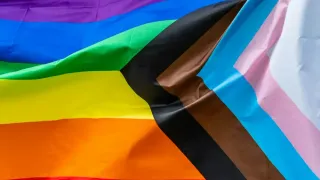 FBI Employee Sues Over Firing Linked to Pride Flag Display, Raising LGBTQ+ Workplace Concerns